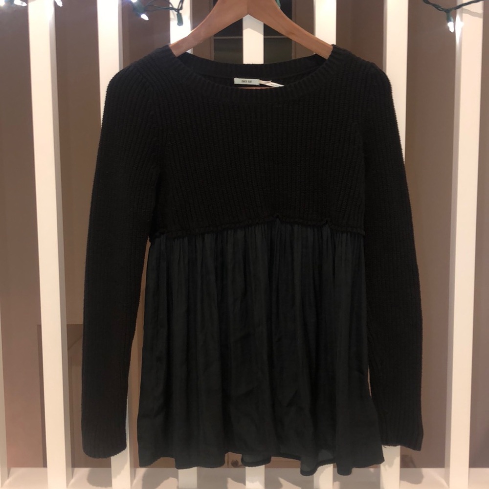 Women’s black sweater with sheer flowy material